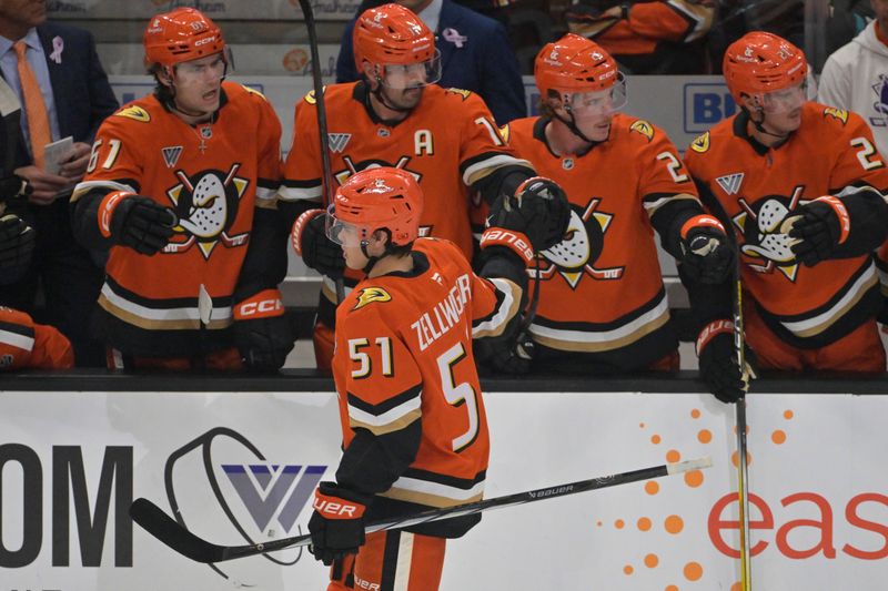 Nov 5, 2024; Anaheim, California, USA; Anaheim Ducks defenseman Olen Zellweger (51) is congratulated after scoring a goal in the first period against the Vancouver Canucks at Honda Center. Mandatory Credit: Jayne Kamin-Oncea-Imagn Images