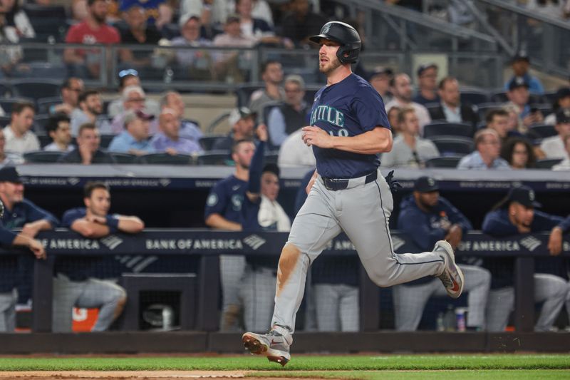 May 21, 2024; Bronx, New York, USA; Seattle Mariners designated hitter Mitch Garver (18) scores a run on a hit by shortstop Dylan Moore (not pictured) during the seventh inning against the New York Yankees   at Yankee Stadium. Mandatory Credit: Vincent Carchietta-USA TODAY Sports