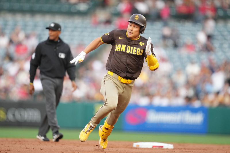 Jun 3, 2024; Anaheim, California, USA; San Diego Padres shortstop Ha-Seong Kim (7) rounds second base on a double in the second inning against the Los Angeles Angels at Angel Stadium. Mandatory Credit: Kirby Lee-USA TODAY Sports