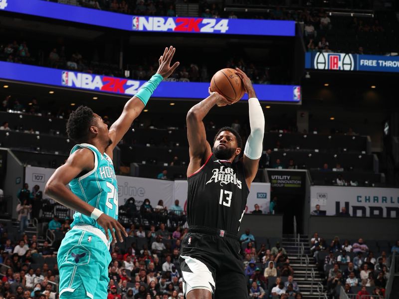 CHARLOTTE, NC - MARCH 31: Paul George #13 of the LA Clippers shoots the ball over Brandon Miller #24 of the Charlotte Hornets during the game on March 31, 2024 at Spectrum Center in Charlotte, North Carolina. NOTE TO USER: User expressly acknowledges and agrees that, by downloading and or using this photograph, User is consenting to the terms and conditions of the Getty Images License Agreement. Mandatory Copyright Notice: Copyright 2024 NBAE (Photo by Kent Smith/NBAE via Getty Images)