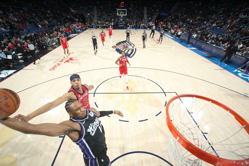 NEW ORLEANS, LA - DECEMBER 12: Issac Jones #17 of the Sacramento Kings dunks the ball during the game against the New Orleans Pelicans on December 12, 2024 at the Smoothie King Center in New Orleans, Louisiana. NOTE TO USER: User expressly acknowledges and agrees that, by downloading and or using this Photograph, user is consenting to the terms and conditions of the Getty Images License Agreement. Mandatory Copyright Notice: Copyright 2024 NBAE (Photo by Layne Murdoch Jr./NBAE via Getty Images)