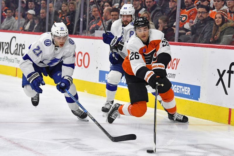 Feb 27, 2024; Philadelphia, Pennsylvania, USA; Philadelphia Flyers defenseman Sean Walker (26) reaches for the puck against Tampa Bay Lightning center Brayden Point (21) during the second period at Wells Fargo Center. Mandatory Credit: Eric Hartline-USA TODAY Sports