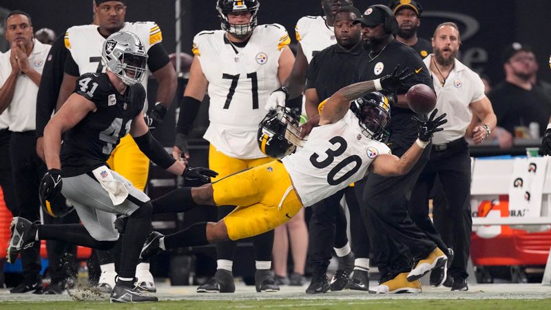 Pittsburgh Steelers running back Jaylen Warren (30) dives as he attempts a catch, but falls out of bounds, during the second half of an NFL football game against the Las Vegas Raiders Sunday, Sept. 24, 2023, in Las Vegas. (AP Photo/Mark J. Terrill)