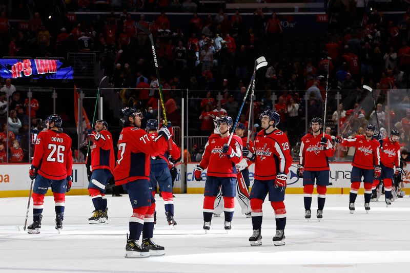 Apr 13, 2024; Washington, District of Columbia, USA; Washington Capitals players salute the fans after their game against the Tampa Bay Lightning at Capital One Arena. Mandatory Credit: Geoff Burke-USA TODAY Sports