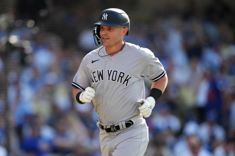 Jun 3, 2023; Los Angeles, California, USA; New York Yankees left fielder Jake Bauers (61) celebrates after hitting a home run in the fourth inning against the Los Angeles Dodgers at Dodger Stadium. Mandatory Credit: Kirby Lee-USA TODAY Sports