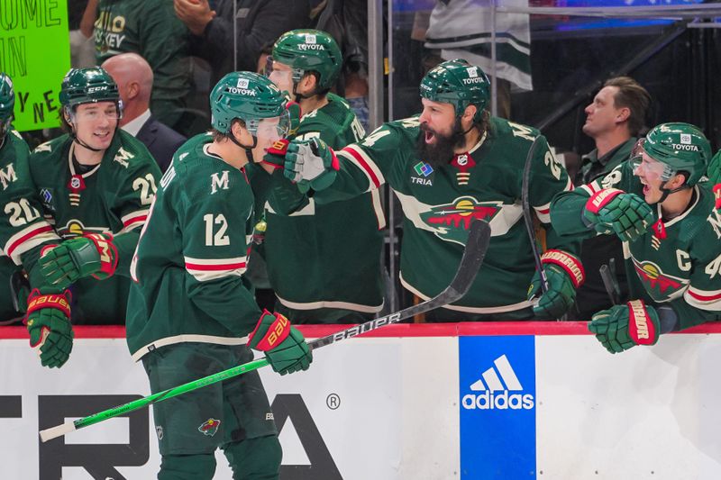 Nov 28, 2023; Saint Paul, Minnesota, USA; Minnesota Wild left wing Matt Boldy (12) celebrates his goal against the St. Louis Blues in the third period at Xcel Energy Center. Mandatory Credit: Brad Rempel-USA TODAY Sports