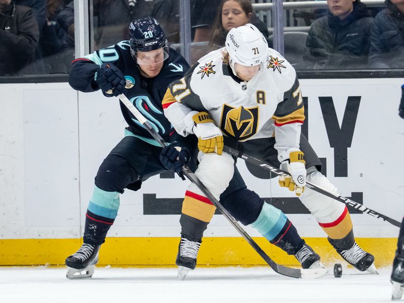 Oct 11, 2025; Seattle, Washington, USA; Seattle Kraken forward Eeli Tolvanen (20) and Vegas Golden Knights forward William Karlsson (71) battle for the puck during the third period at Climate Pledge Arena. Mandatory Credit: Stephen Brashear-Imagn Images