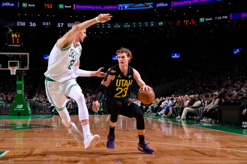 BOSTON, MA - JANUARY 5: Lauri Markkanen #23 of the Utah Jazz handles the ball against defender Kristaps Porzingis #8 of the Boston Celtics during the game on January 5, 2024 at the TD Garden in Boston, Massachusetts. NOTE TO USER: User expressly acknowledges and agrees that, by downloading and or using this photograph, User is consenting to the terms and conditions of the Getty Images License Agreement. Mandatory Copyright Notice: Copyright 2024 NBAE  (Photo by Brian Babineau/NBAE via Getty Images)