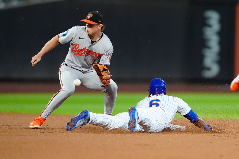 Aug 19, 2024; New York City, New York, USA; New York Mets right fielder Starling Marte (6) steals second base as Baltimore Orioles second baseman Jackson Holiday (7) receives the throw during the first inning at Citi Field. Mandatory Credit: Gregory Fisher-USA TODAY Sports