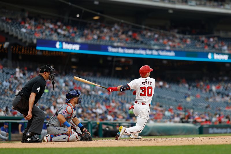 Jun 5, 2024; Washington, District of Columbia, USA; Washington Nationals outfielder Jacob Young (30) singles against the New York Mets during the third inning at Nationals Park. Mandatory Credit: Geoff Burke-USA TODAY Sports