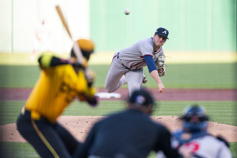 May 9, 2025; Pittsburgh, Pennsylvania, USA; Atlanta Braves starting pitcher Bryce Elder (55) pitches to Pittsburgh Pirates designated hitter Andrew McCutchen (22) during the first inning at PNC Park. Mandatory Credit: Scott Galvin-Imagn Images