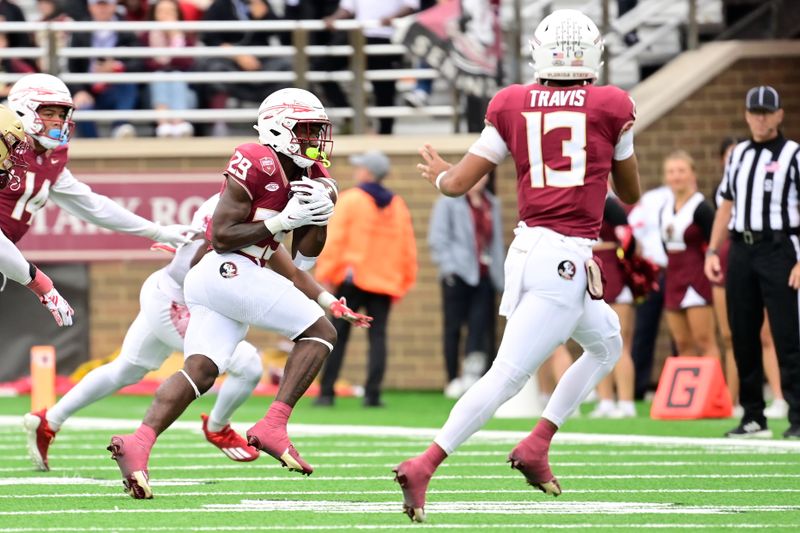 Sep 16, 2023; Chestnut Hill, Massachusetts, USA; Florida State Seminoles running back Rodney Hill (29) catches a pass from Florida State Seminoles quarterback Jordan Travis (13) during the second half against the Boston College Eagles at Alumni Stadium. Mandatory Credit: Eric Canha-USA TODAY Sports