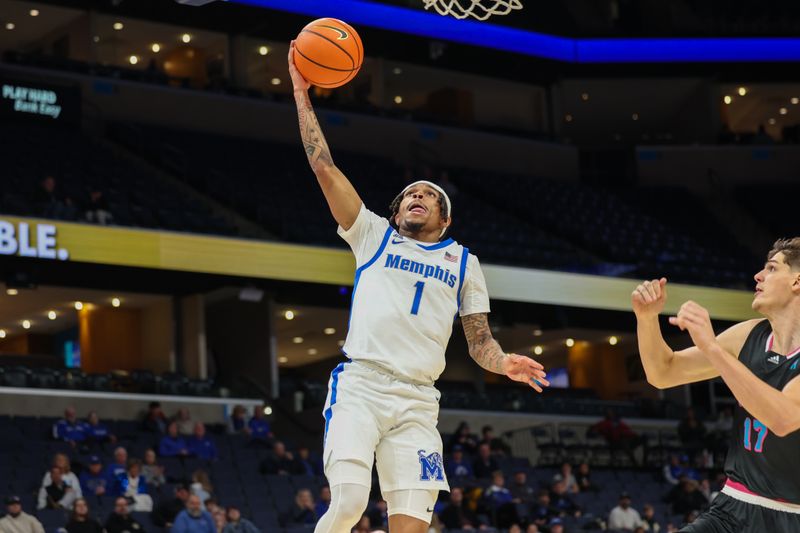 Jan 29, 2026; Memphis, Tennessee, USA; Memphis Tigers guard Dug McDaniel (1) shoots the ball against the Florida Atlantic Owls during the first half at FedExForum. Mandatory Credit: Wesley Hale-Imagn Images