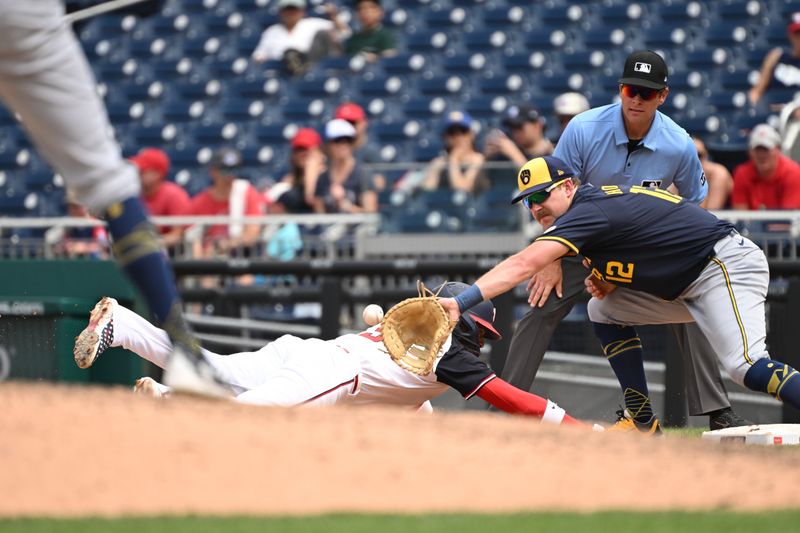 Aug 4, 2024; Washington, District of Columbia, USA; Milwaukee Brewers first baseman Rhys Hoskins (12) reaches for the ball during a pick off attempt in front of Washington Nationals shortstop CJ Abrams (5) during the sixth inning at Nationals Park. Mandatory Credit: Rafael Suanes-USA TODAY Sports