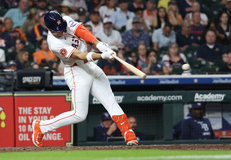 May 29, 2025; Houston, Texas, USA; Houston Astros right fielder Cam Smith (11) hits a double against the Tampa Bay Rays in the fifth inning at Daikin Park. Mandatory Credit: Thomas Shea-Imagn Images