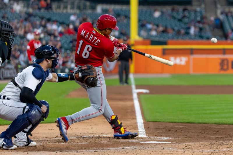 Sep 13, 2023; Detroit, Michigan, USA; Cincinnati Reds shortstop Noelvi Marte (16) hits a single in the fourth inning against the Detroit Tigers at Comerica Park. Mandatory Credit: David Reginek-USA TODAY Sports