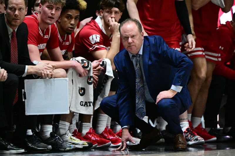 Mar 10, 2024; West Lafayette, Indiana, USA; Wisconsin Badgers head coach Greg Gard watches the game from in front of his team bench during the first half against the Purdue Boilermakers at Mackey Arena. Mandatory Credit: Marc Lebryk-USA TODAY Sports