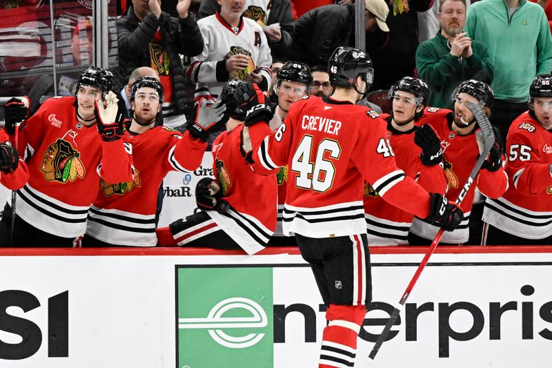 Mar 17, 2026; Chicago, Illinois, USA;  Chicago Blackhawks defenseman Louis Crevier (46) celebrates with teammates after scoring a goal against the Minnesota Wild during the first period at United Center. Mandatory Credit: Matt Marton-Imagn Images
