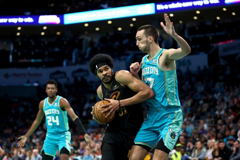 CHARLOTTE, NORTH CAROLINA - MARCH 27: Jarrett Allen #31 of the Cleveland Cavaliers drives to the basket against Aleksej Pokusevski #17 of the Charlotte Hornets during the second half of the game at Spectrum Center on March 27, 2024 in Charlotte, North Carolina. NOTE TO USER: User expressly acknowledges and agrees that, by downloading and or using this photograph, User is consenting to the terms and conditions of the Getty Images License Agreement. (Photo by Jared C. Tilton/Getty Images)