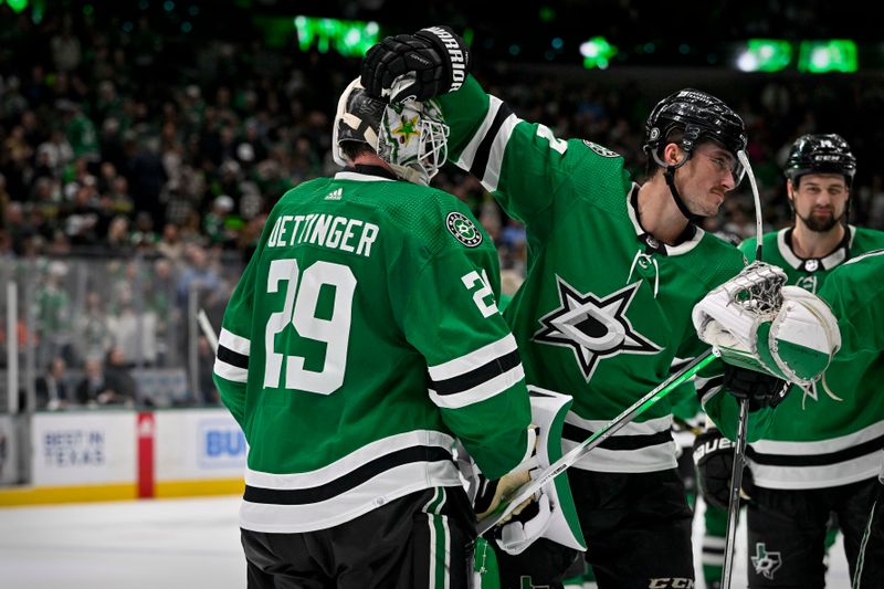 Jan 25, 2024; Dallas, Texas, USA; Dallas Stars goaltender Jake Oettinger (29) and left wing Mason Marchment (27) celebrate after defenseman Thomas Harley (not pictured) scores the game winning as the Stars defeat the Anaheim Ducks in the overtime period at the American Airlines Center. Mandatory Credit: Jerome Miron-USA TODAY Sports