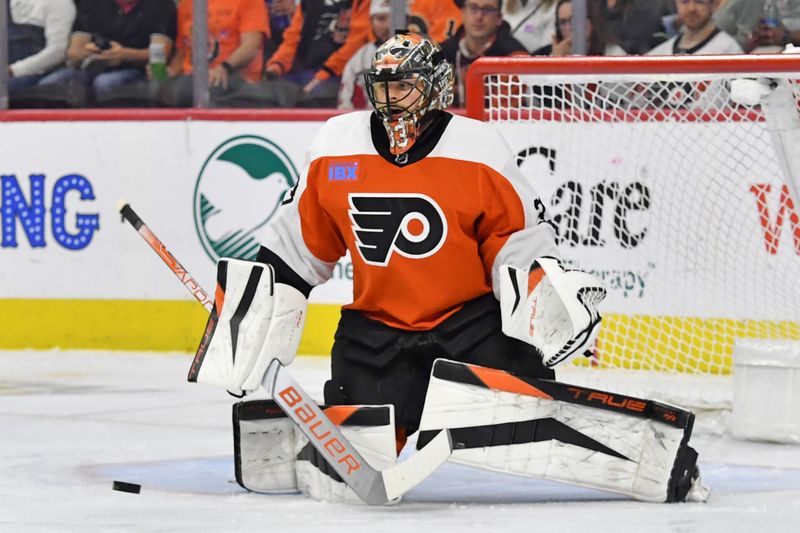 Apr 16, 2024; Philadelphia, Pennsylvania, USA; Philadelphia Flyers goaltender Samuel Ersson (33) makes a save against the Washington Capitals during the first period at Wells Fargo Center. Mandatory Credit: Eric Hartline-USA TODAY Sports