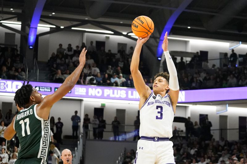 Jan 7, 2024; Evanston, Illinois, USA; Northwestern Wildcats guard Ty Berry (3) makes a three point basket over Michigan State Spartans guard A.J. Hoggard (11) during the second half at Welsh-Ryan Arena. Mandatory Credit: David Banks-USA TODAY Sports