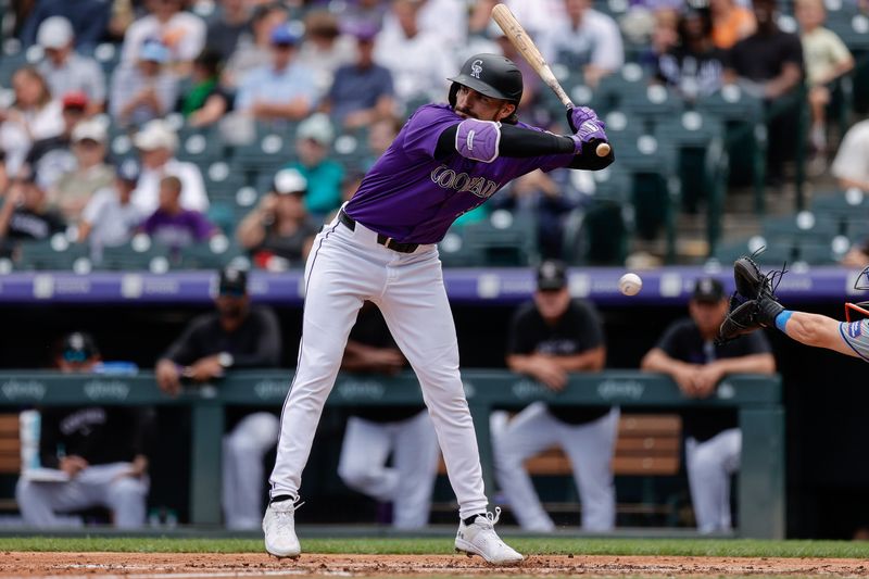 Aug 8, 2024; Denver, Colorado, USA; Colorado Rockies left fielder Sam Hilliard (16) moves away from a pitch in the fifth inning against the New York Mets at Coors Field. Mandatory Credit: Isaiah J. Downing-USA TODAY Sports