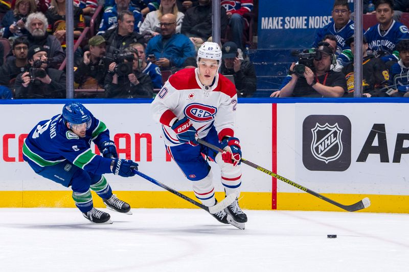 Mar 21, 2024; Vancouver, British Columbia, CAN; Vancouver Canucks forward Conor Garland (8) stick checks Montreal Canadiens forward Juraj Slafkovsky (20) in the third period at Rogers Arena. Vancouver won 4 -1. Mandatory Credit: Bob Frid-USA TODAY Sports