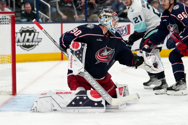 Mar 3, 2023; Columbus, Ohio, USA; Columbus Blue Jackets goaltender Elvis Merzlikins (90) makes a glove save during the third period against the Seattle Kraken  at Nationwide Arena. Mandatory Credit: Jason Mowry-USA TODAY Sports