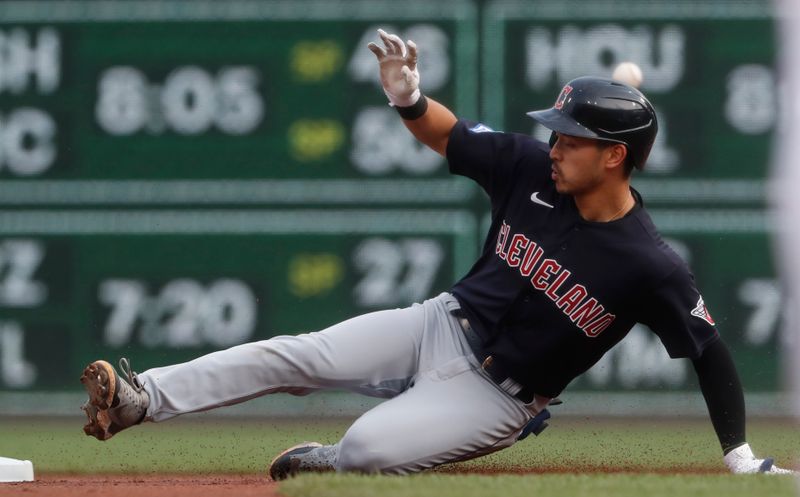 Jul 18, 2023; Pittsburgh, Pennsylvania, USA;  Cleveland Guardians left fielder Steven Kwan (38) slides into second base with a double against the Pittsburgh Pirates during the first inning at PNC Park. Mandatory Credit: Charles LeClaire-USA TODAY Sports