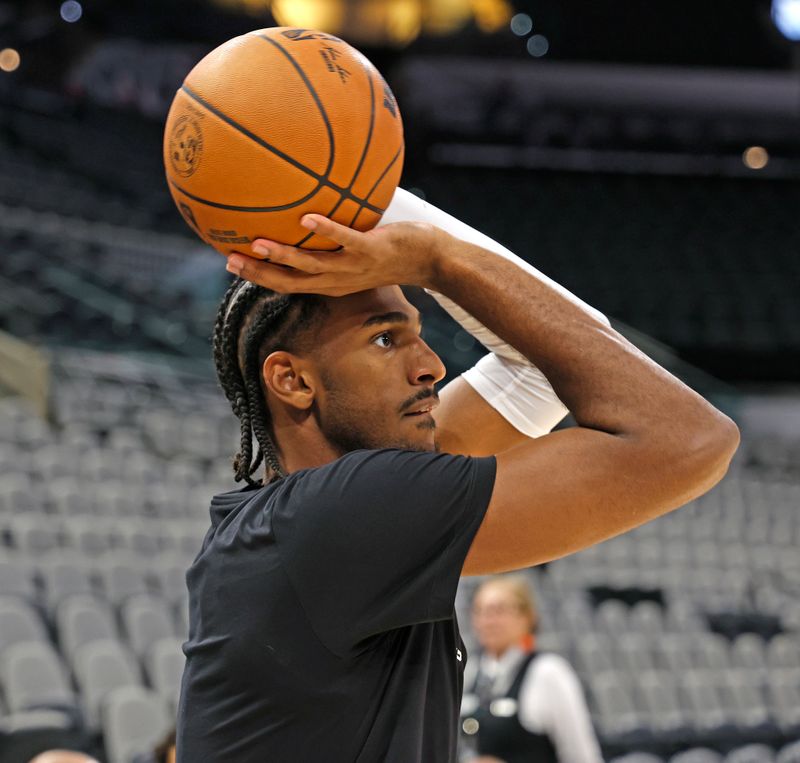 SAN ANTONIO, TX - NOVEMBER 13:  Alexandre Sarr #20 of the Washington Wizards takes warm up shots before their game against the San Antonio Spurs at Frost Bank Center on November 13, 2024 in San Antonio, Texas. NOTE TO USER: User expressly acknowledges and agrees that, by downloading and or using this photograph, User is consenting to terms and conditions of the Getty Images License Agreement. (Photo by Ronald Cortes/Getty Images)