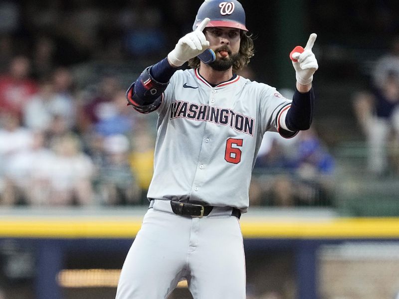 Jul 12, 2024; Milwaukee, Wisconsin, USA;  Washington Nationals designated hitter Jesse Winker (6) reacts after hitting a double during the first inning against the Milwaukee Brewers at American Family Field. Mandatory Credit: Jeff Hanisch-USA TODAY Sports