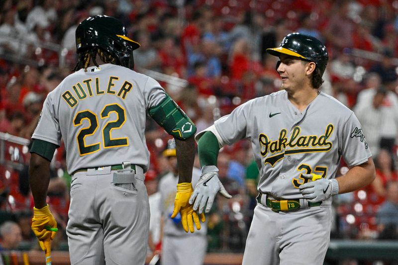 Aug 16, 2023; St. Louis, Missouri, USA;  Oakland Athletics pinch hitter Tyler Soderstrom (37) celebrates with Lawrence Butler (22) after hitting a solo home run against the St. Louis Cardinals during the ninth inning at Busch Stadium. Mandatory Credit: Jeff Curry-USA TODAY Sports