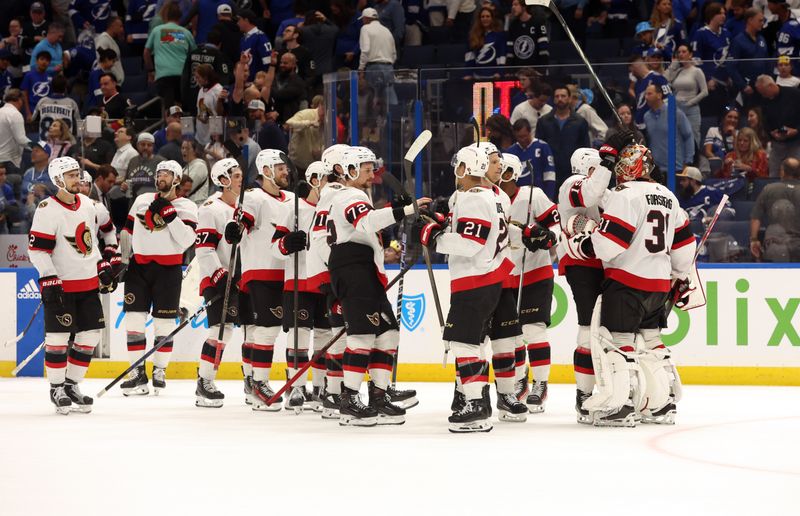 Apr 11, 2024; Tampa, Florida, USA; Ottawa Senators goaltender Anton Forsberg (31) and teammates celebrate  after they beat the Tampa Bay Lightning during a shoot out at Amalie Arena. Mandatory Credit: Kim Klement Neitzel-USA TODAY Sports