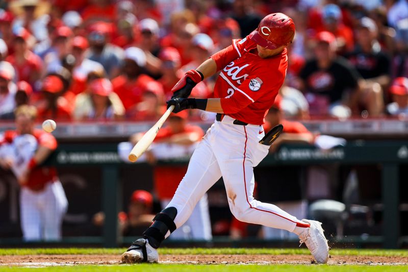 Jun 28, 2025; Cincinnati, Ohio, USA; Cincinnati Reds outfielder TJ Friedl (29) hits a RBI single in the second inning against the San Diego Padres at Great American Ball Park. Mandatory Credit: Katie Stratman-Imagn Images