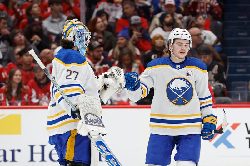 Nov 22, 2023; Washington, District of Columbia, USA; Buffalo Sabres left wing Zach Benson (9) celebrates with Sabres goaltender Devon Levi (27) after scoring a goal against the Washington Capitals /d1q/ at Capital One Arena. Mandatory Credit: Geoff Burke-USA TODAY Sports