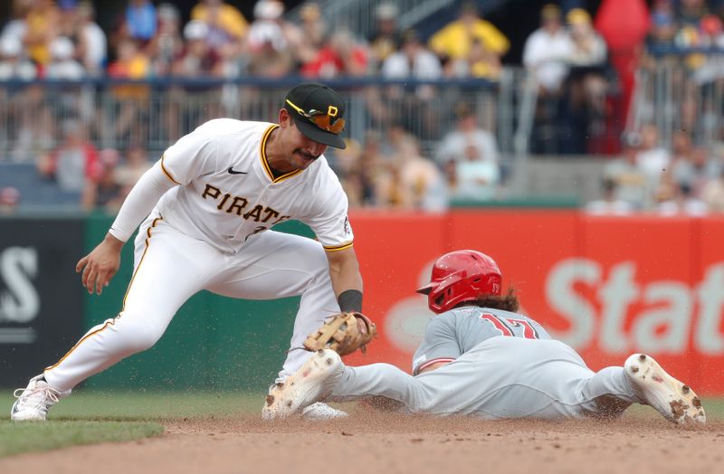 Jun 19, 2024; Pittsburgh, Pennsylvania, USA;  Cincinnati Reds center fielder Stuart Fairchild (17) steals second base as Pittsburgh Pirates second baseman Nick Gonzales (39) applies a late tag during the eighth inning at PNC Park. The Pirates shutout the Reds 1-0. Mandatory Credit: Charles LeClaire-USA TODAY Sports