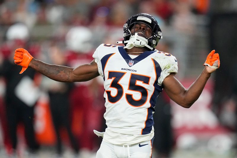 Denver Broncos cornerback Ja'Quan McMillian (35) celebrates after sacking Arizona Cardinals quarterback Clayton Tune during the second half of an NFL preseason football game in Glendale, Ariz., Friday, Aug. 11, 2023. (AP Photo/Ross D. Franklin)