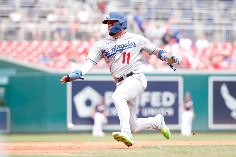 Sep 10, 2023; Washington, District of Columbia, USA; Los Angeles Dodgers shortstop Miguel Rojas (11) slides into third base ahead of a tag against the Washington Nationals during the second inning at Nationals Park. Mandatory Credit: Amber Searls-USA TODAY Sports