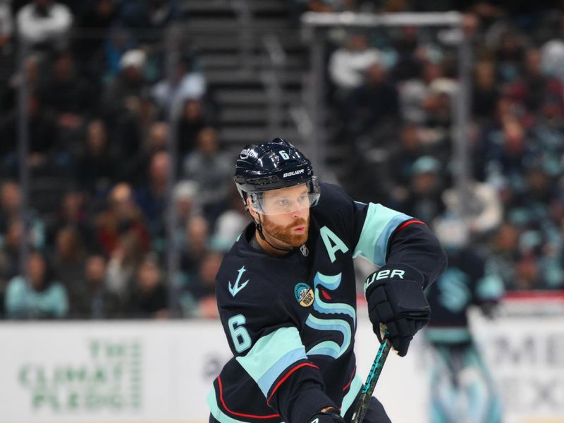 Nov 12, 2024; Seattle, Washington, USA; Seattle Kraken defenseman Adam Larsson (6) shoots the puck against the Columbus Blue Jackets during the third period at Climate Pledge Arena. Mandatory Credit: Steven Bisig-Imagn Images