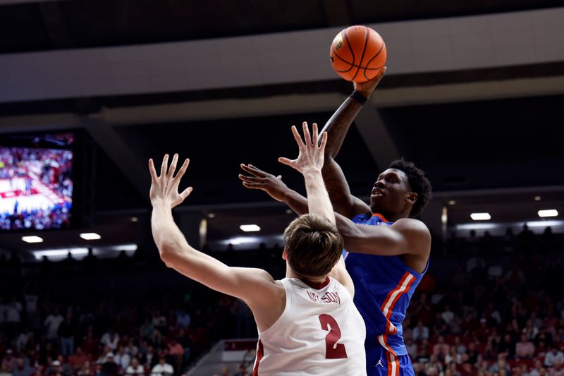 Feb 21, 2024; Tuscaloosa, Alabama, USA; Florida Gators forward Tyrese Samuel (4) shoots over Alabama Crimson Tide forward Grant Nelson (2) during the second half at Coleman Coliseum. Mandatory Credit: Butch Dill-USA TODAY Sports