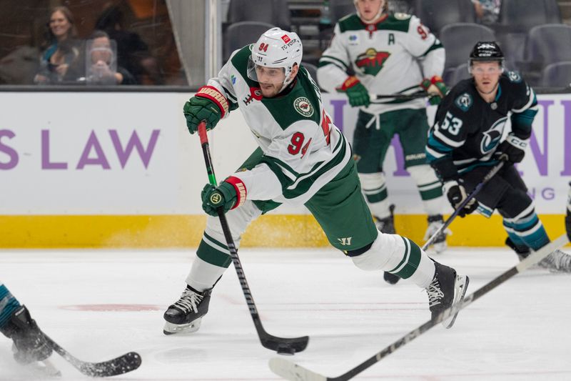 Nov 7, 2024; San Jose, California, USA;  Minnesota Wild center Jakub Lauko (94) shoots during the third period against the San Jose Sharks at SAP Center at San Jose. Mandatory Credit: Stan Szeto-Imagn Images