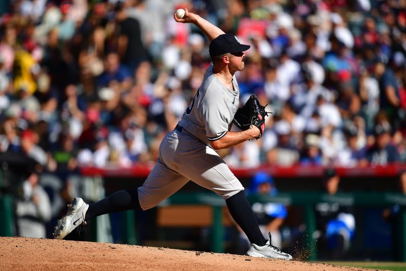 Jul 19, 2023; Anaheim, California, USA; New York Yankees starting pitcher Carlos Rodon (55) throws against the Los Angeles Angels during the third inning at Angel Stadium. Mandatory Credit: Gary A. Vasquez-USA TODAY Sports