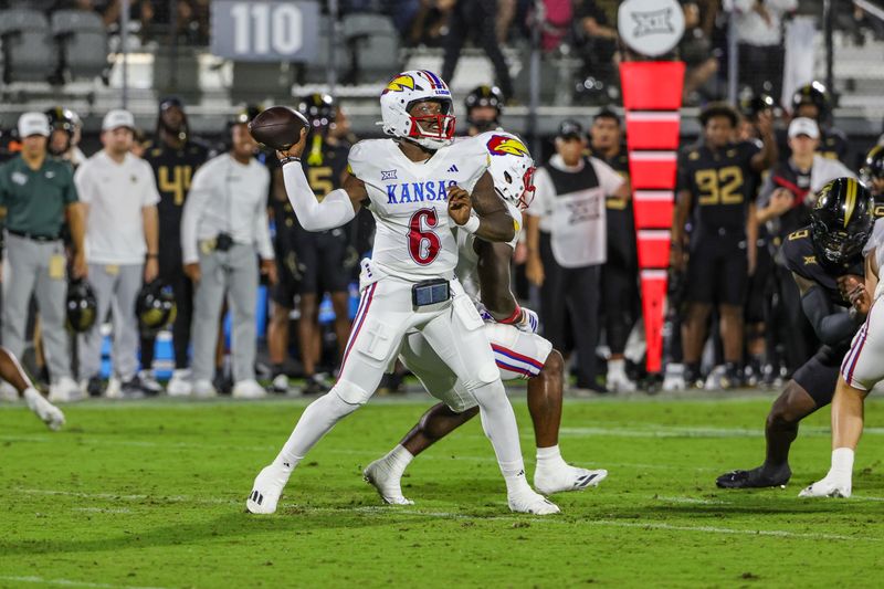 Oct 4, 2025; Orlando, Florida, USA; Kansas Jayhawks quarterback Jalon Daniels (6) throws a pass during the first quarter against the UCF Knights at FBC Mortgage Stadium. Mandatory Credit: Mike Watters-Imagn Images