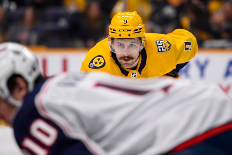 Apr 13, 2024; Nashville, Tennessee, USA; Nashville Predators left wing Filip Forsberg (9) awaits the face off against the Columbus Blue Jackets during the third period at Bridgestone Arena. Mandatory Credit: Steve Roberts-USA TODAY Sports