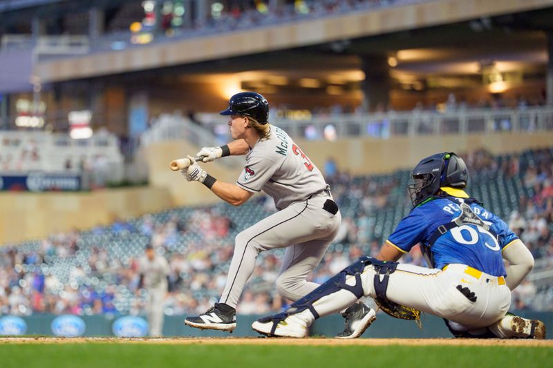 Sep 12, 2025; Minneapolis, Minnesota, USA; Arizona Diamondbacks left fielder Jake McCarthy (31) shows a bunt on a pitch by Minnesota Twins starting pitcher Pablo Lopez (49) in the second inning at Target Field. Mandatory Credit: Matt Blewett-Imagn Images