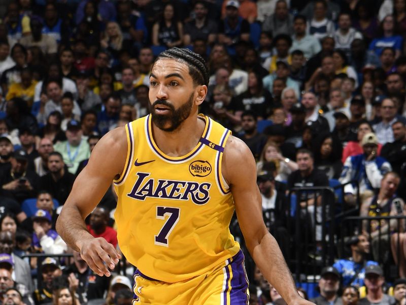 ORLANDO, FL - MARCH 24:   Gabe Vincent #7 of the Los Angeles Lakers dribbles the ball during the game against the Orlando Magic  on March 24, 2025 at Kia Center in Orlando, Florida. NOTE TO USER: User expressly acknowledges and agrees that, by downloading and or using this photograph, User is consenting to the terms and conditions of the Getty Images License Agreement. Mandatory Copyright Notice: Copyright 2025 NBAE (Photo by Gary Bassing/NBAE via Getty Images)