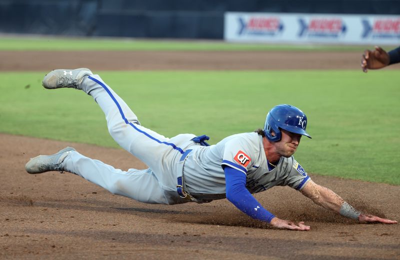 Apr 29, 2025; St. Petersburg, Florida, USA;  Kansas City Royals outfielder Drew Waters (8) slides into third against the Tampa Bay Rays during the second inning at George M. Steinbrenner Field. Mandatory Credit: Kim Klement Neitzel-Imagn Images