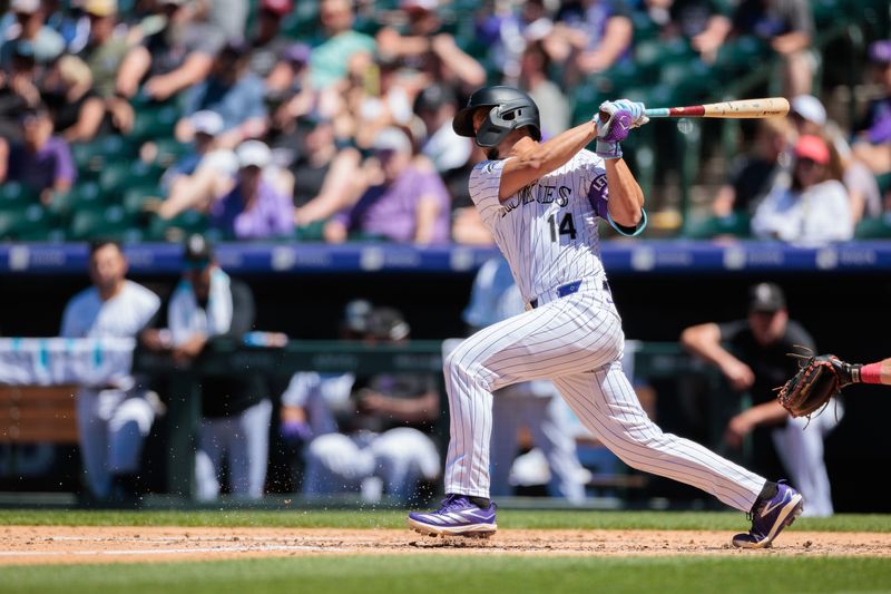 Jun 5, 2024; Denver, Colorado, USA; Colorado Rockies shortstop Ezequiel Tovar (14) bats during the fourth inning against the Cincinnati Reds at Coors Field. Mandatory Credit: Andrew Wevers-USA TODAY Sports