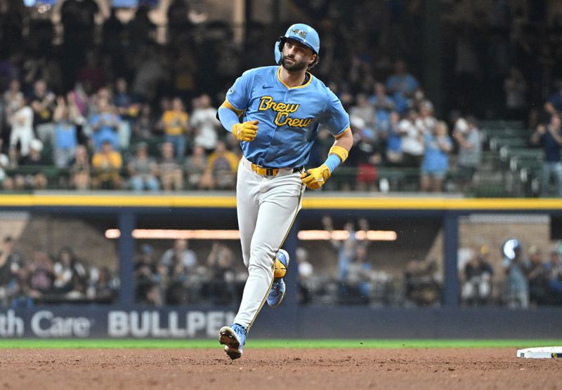 Sep 20, 2024; Milwaukee, Wisconsin, USA; Milwaukee Brewers outfielder Garrett Mitchell (5) rounds the bases after hitting a home run against the Arizona Diamondbacks in the fifth inning at American Family Field. Mandatory Credit: Michael McLoone-Imagn Images